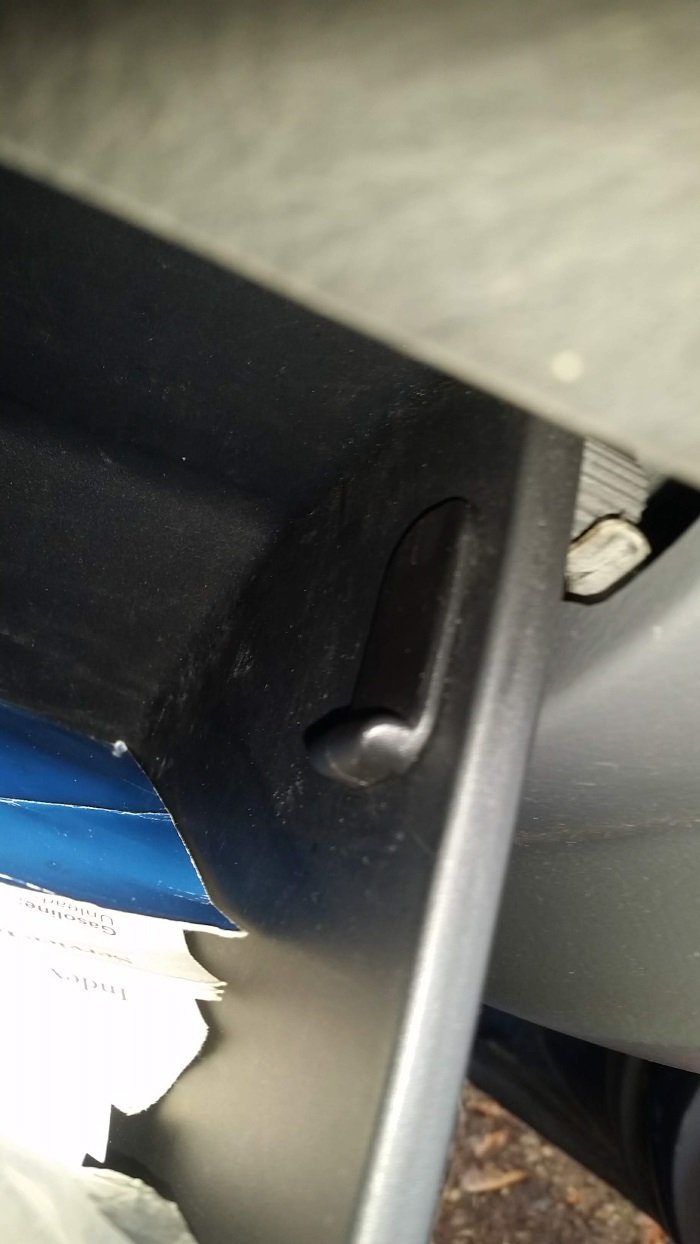 The glove box stopper, still attached, from inside the glove box.