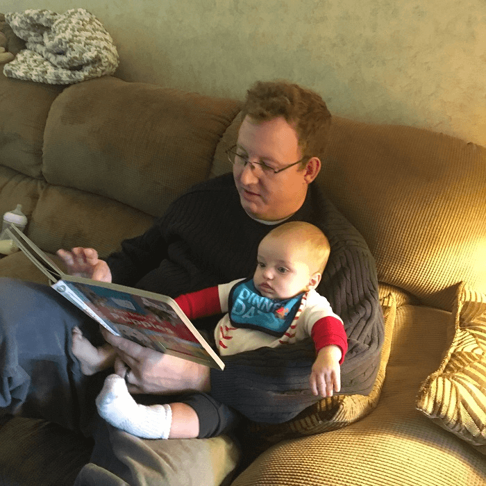 Reading to the little guy.